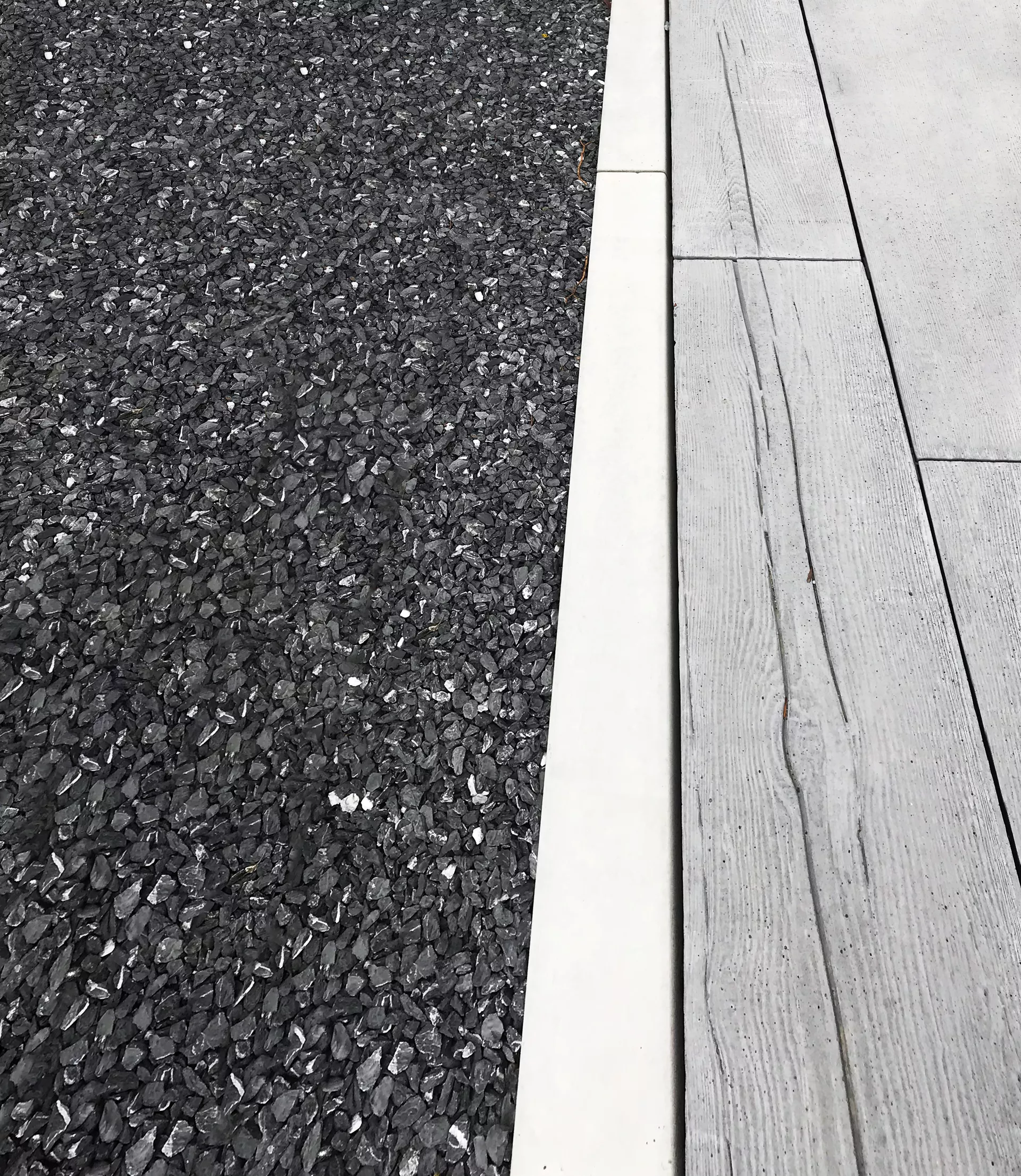 Randabschlussstein grau glatt Kanten leicht gerundet gegossen L 100 cm B 10 cm H 10 cm