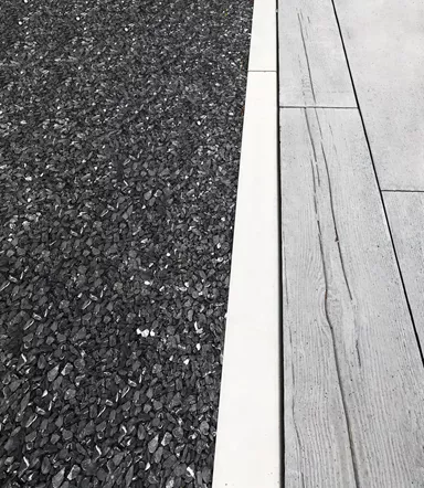 Randabschlussstein grau glatt Kanten leicht gerundet gegossen L 100 cm B 10 cm H 10 cm