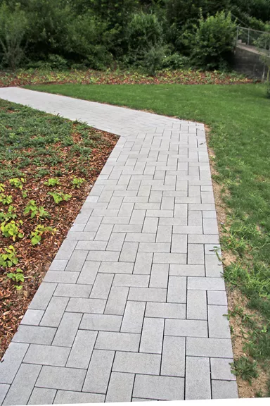 CARENA Pflasterstein mit Nockenverbund grau glatt vollkantig L 25 cm B 12.5 cm H 6 cm